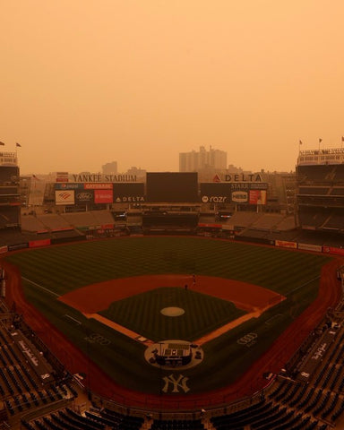 Scene from Yankee Stadium covered in smoke from the wildfires in Canada