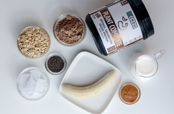 Plant Complete Protein next to banana and other protien ingredients