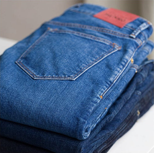 Denim jeans, as displayed here, are part of the latest trend toward affordable, custom-made men's clothing.