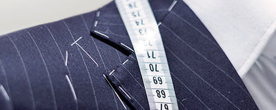 A made-to-measure men's jacket under construction, showing the precise cut of lapel.