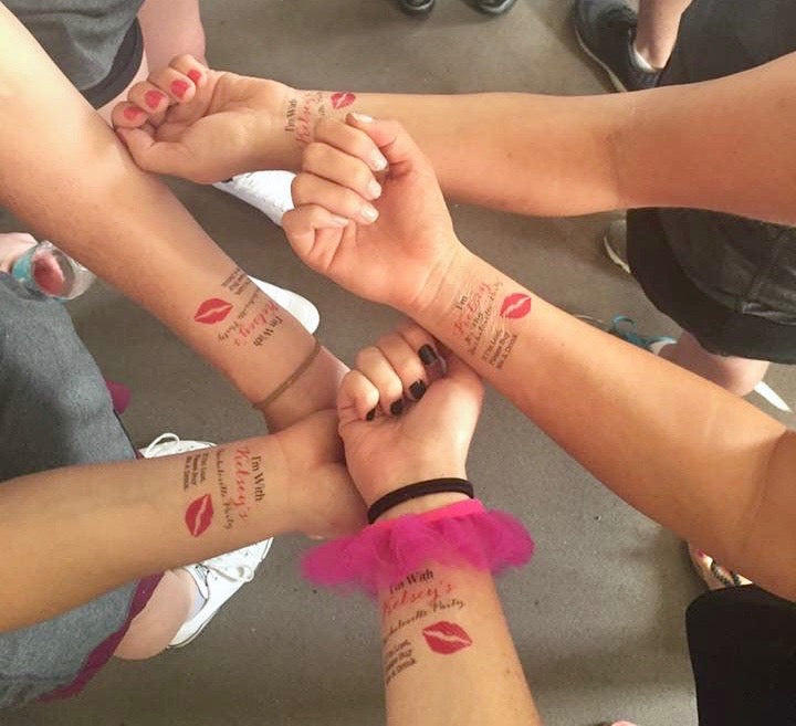 girls showing matching temporary tattoos