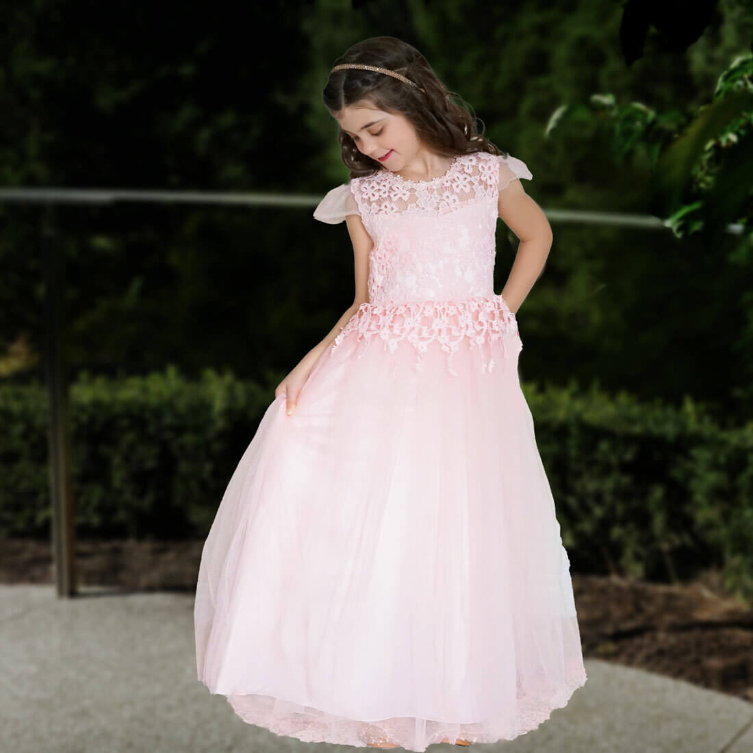 Little girl in a long pink gown