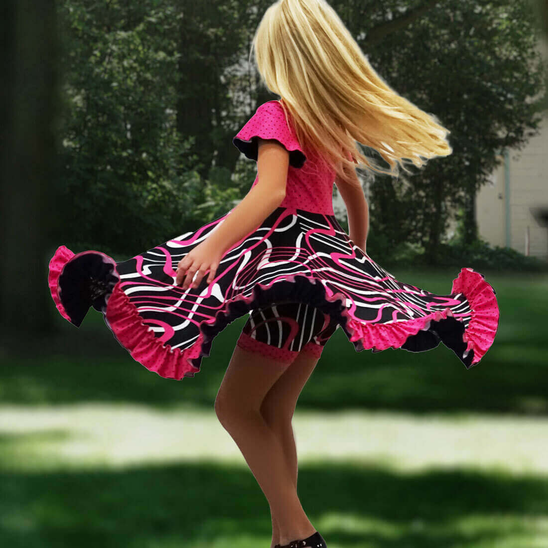 Girl spinning in a pink dress