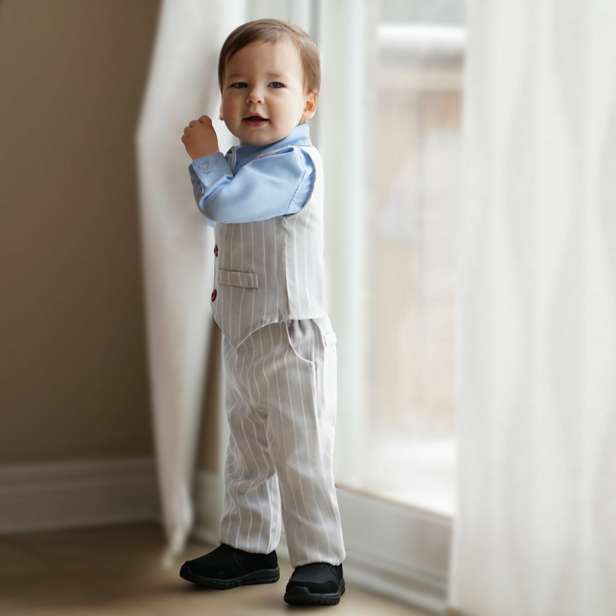 Toddler in grey striped suit and light blue shirt