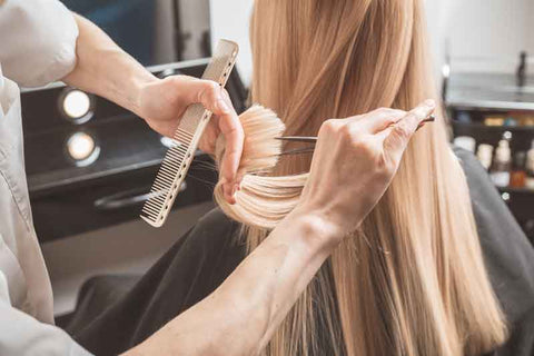 hairdresser trimming hair