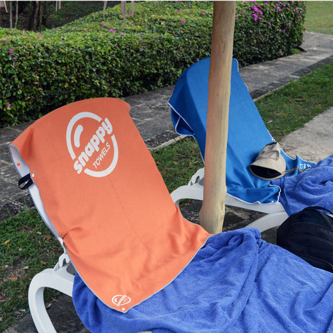 Claiming our spot by the pool with a bright Snappy Towels microfiber beach towel snapped to the back of the chair!