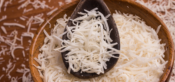 Sweetened Grated Coconut in a Wooden Bowl