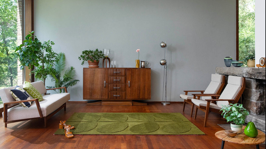 Orla Kiley wool rug 'Solid Stem' in colour Olive, seen in a modern living room