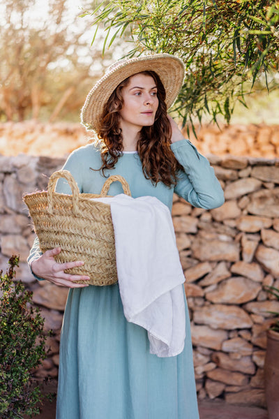 Woman Cleaning Linen Outside