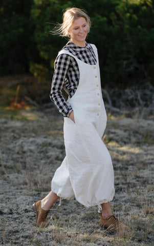 White Button-Front Jumpsuit And Checkered Flannel Underneath