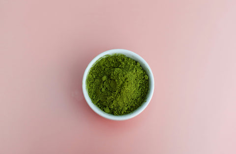 Green powder in a bowl