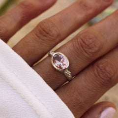 oval morganite set east-west in a bezel