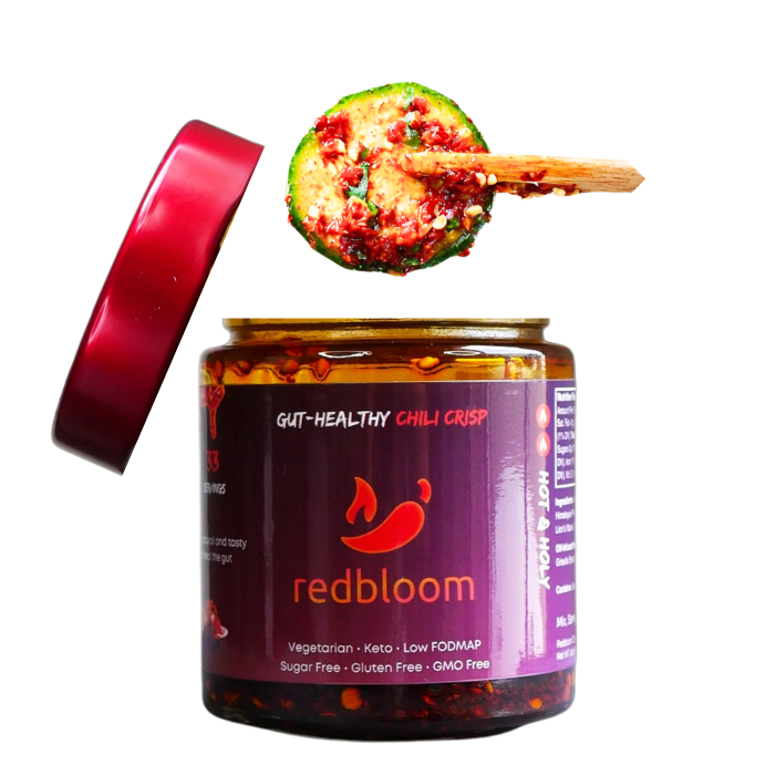 Jar of 'redbloom' gut-healthy chili crisp with a spoonful above it.