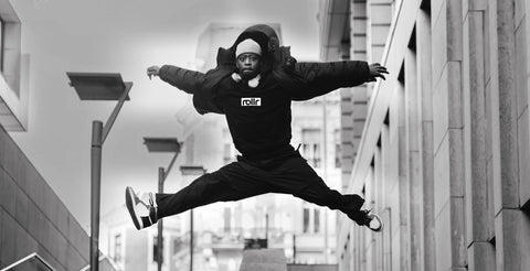 black rollr hoodie on break dancer jumping in the air
