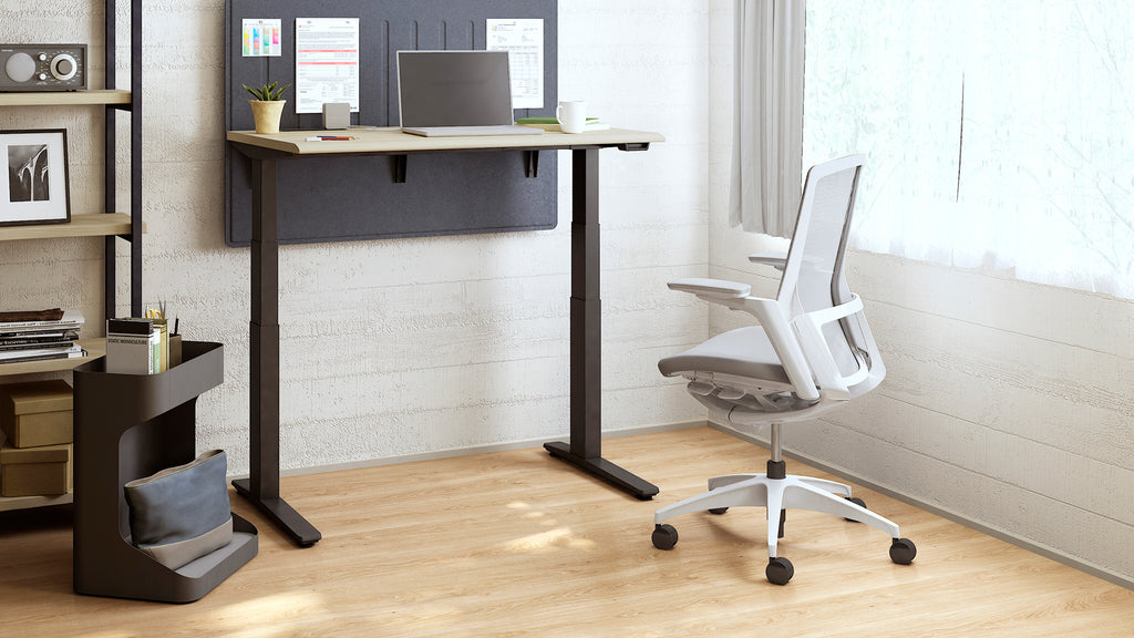 ergonomic chair with height adjustable desk in study room