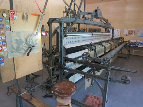 Schiffli embroidery machine from the 1860s that allowed plotting and stitching for mass production embroidery 