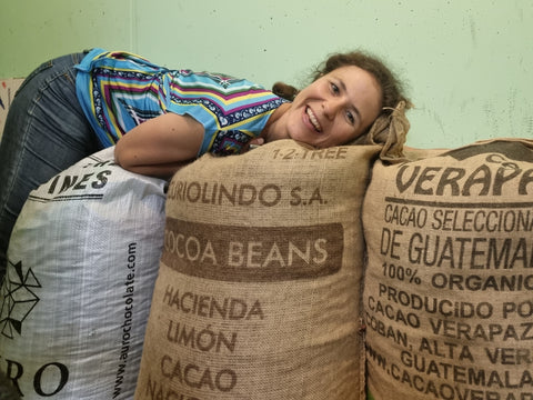 Elsa with bags of cacao beans