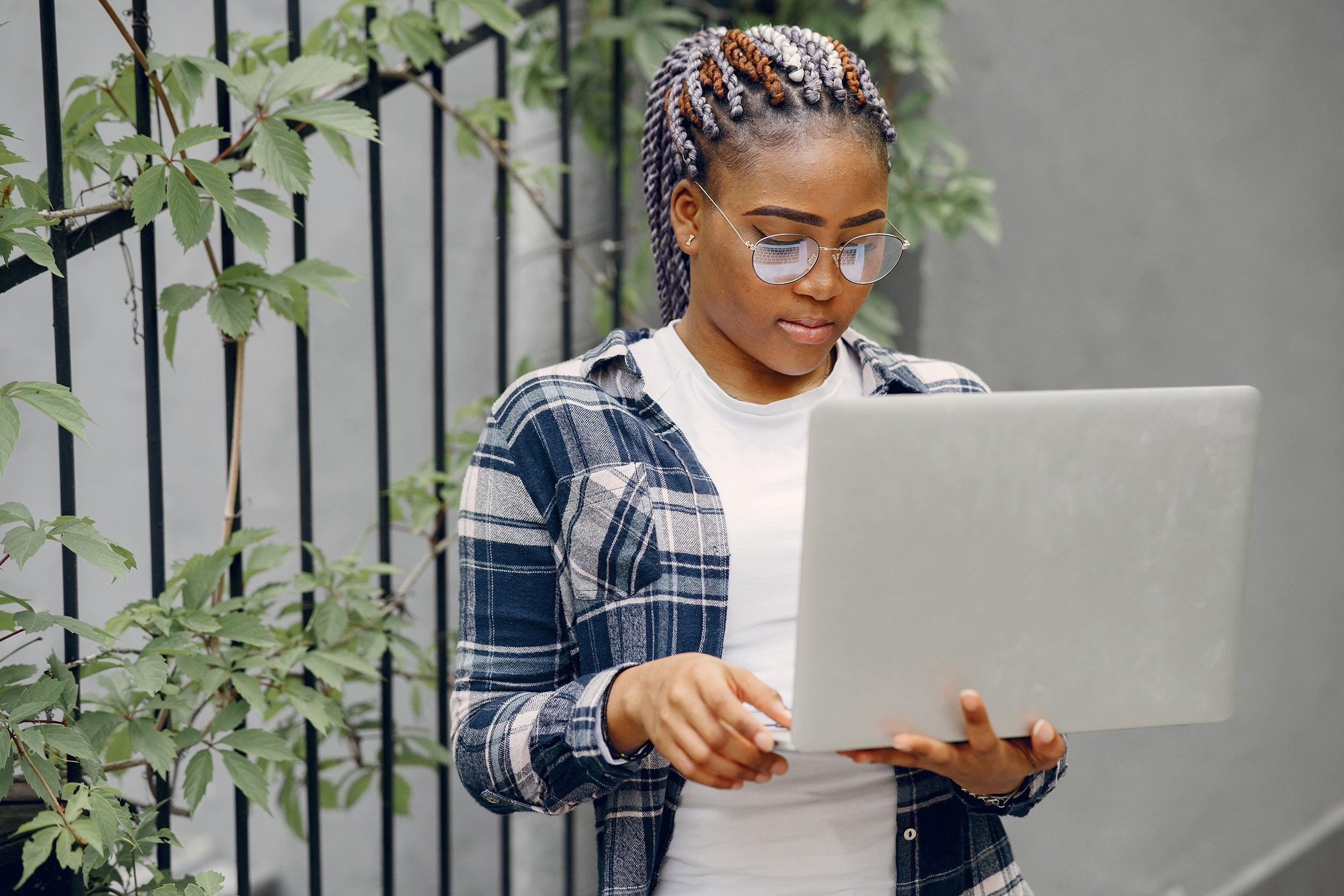 black-girl-in-a-summer-city-with-laptop