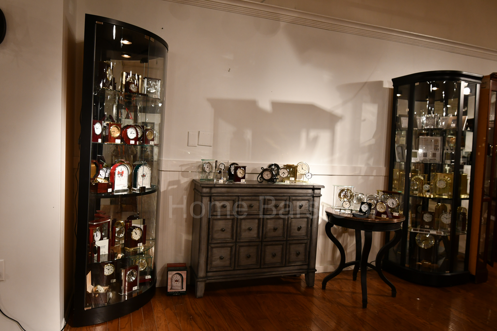 Setting Up and Displaying Items in a Lighted Curio Cabinet - Home Bars USA