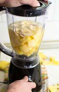 Blending a mango chia smoothie with Nature's Lab Organic Chia Seeds