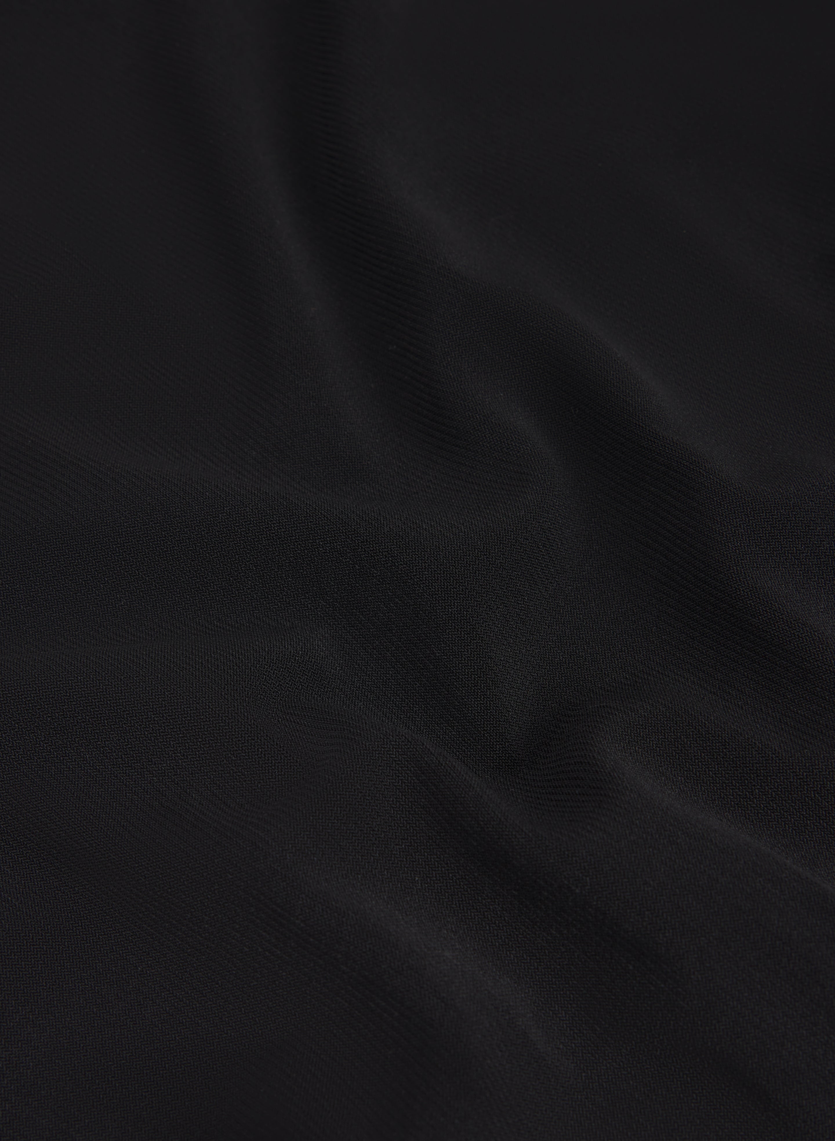 Haut à encolure asymétrique