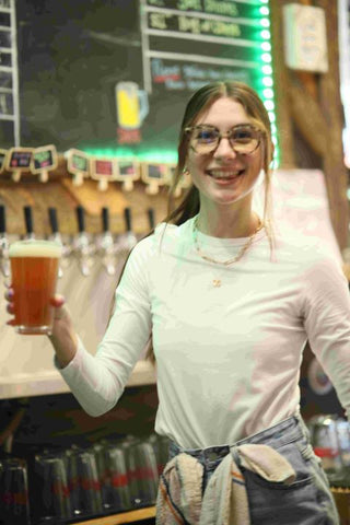 Michaela holding UpCo pint