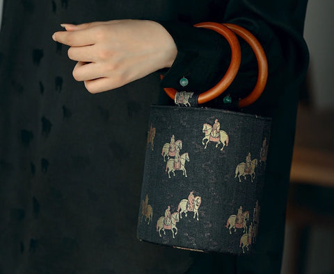 Black bucket bag with horse pattern