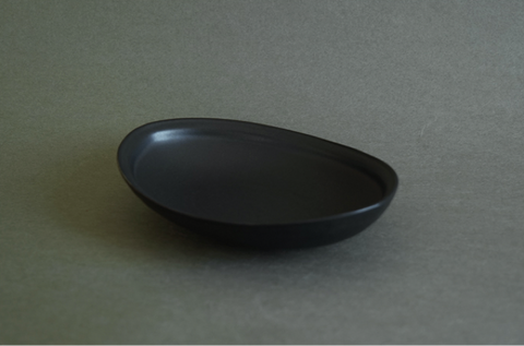black ceramic boat plate