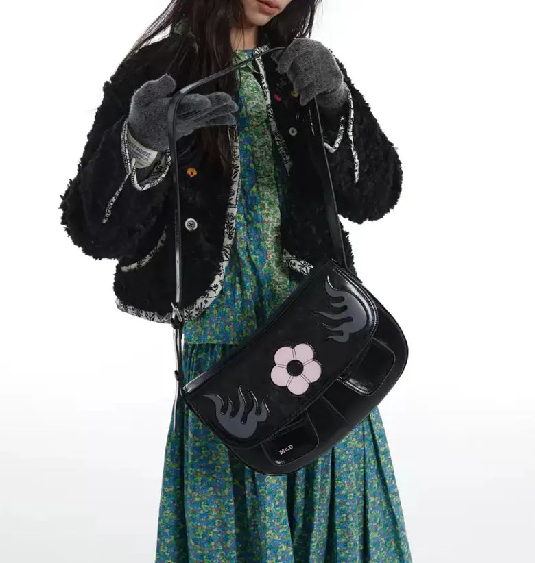 Black Cowhide saddle bag with flower pattern