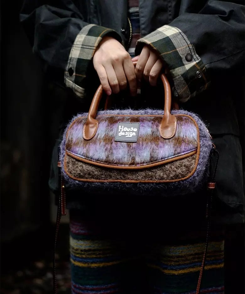 Purple plush crossbody bag with zipper closure