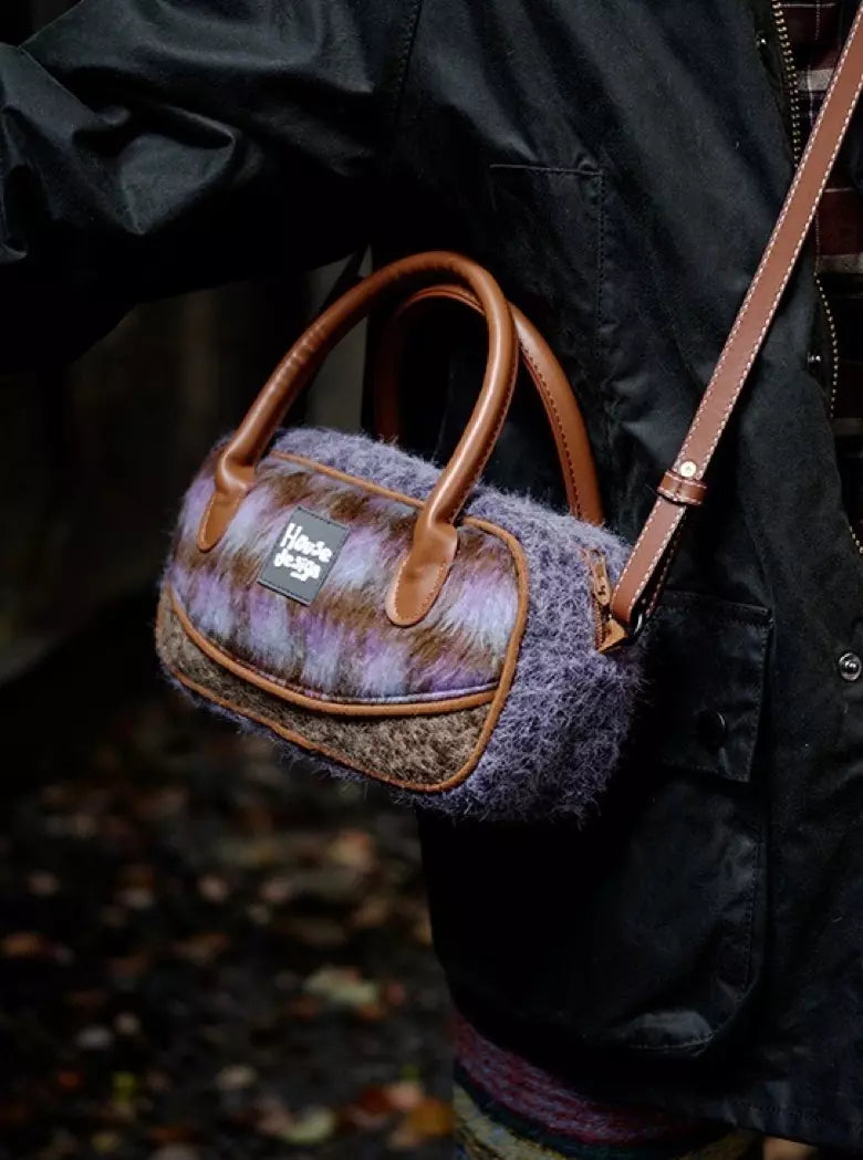 Purple plush crossbody bag with zipper closure