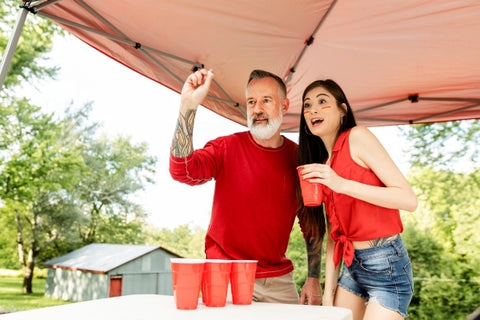 couple-playing-beer-pong-tailgate-party