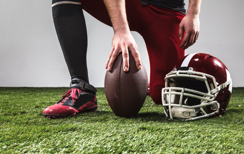 american-football-player-with-ball