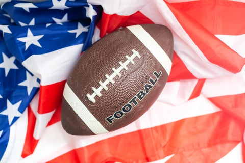 american-football-rugby-ball-against-american-flag