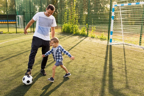 father-son-playing-football