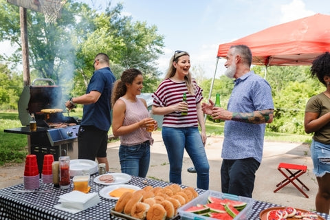 friends-celebrating-eating-tailgate-party