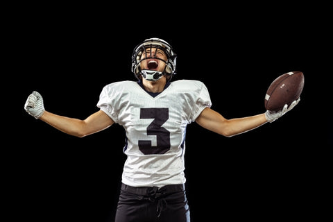portrait-american-football-player-sports-equipment-isolated-black
