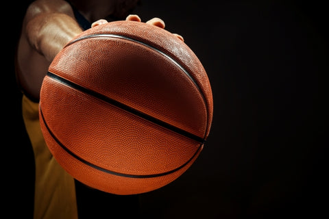 silhouette-view-basketball-player-holding-basket-ball-black-background