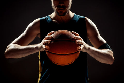 silhouette-view-basketball-player-holding-basket-ball-black-space