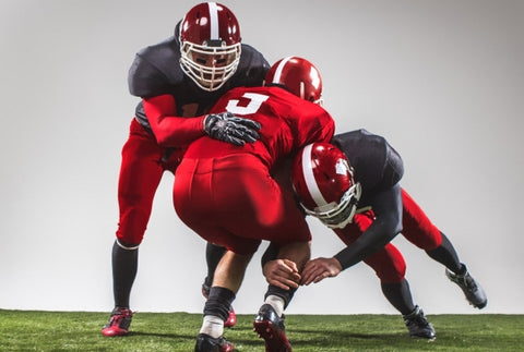 three-american-football-players-action-green-grass-gray-background