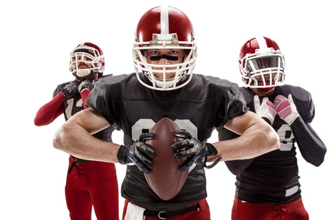 three-caucasian-fitness-men-as-american-football-players-posing-with-ball-white 
