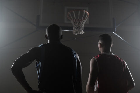 two-basketball-player-looking-basketball-hoop