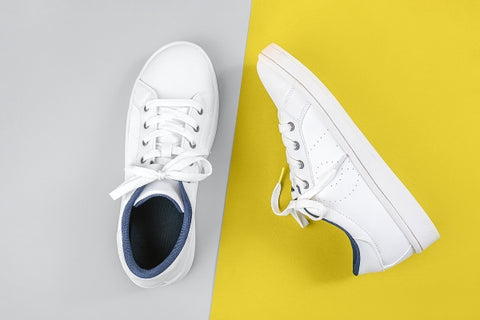 white-sports-shoes-sneakers-with-shoelaces-yellow-gray