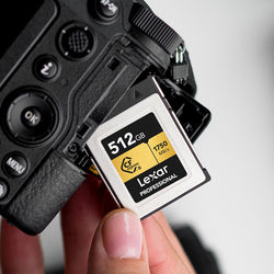 Lexar 512GB CFexpress Type B card being put into a Nikon Mirrorless camera