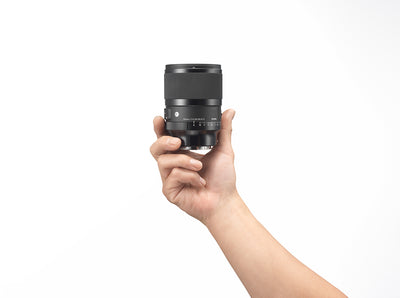 compact design of Sigma 50mm DG DN lens in hand