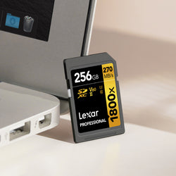 Lexar V60 SD card resting against Macbook laptop
