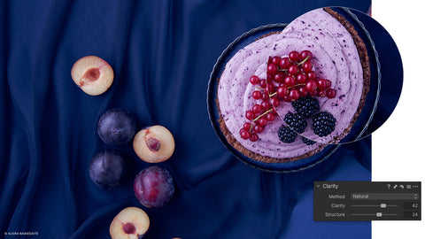 Top down photo of fruit pie on blue table cloth