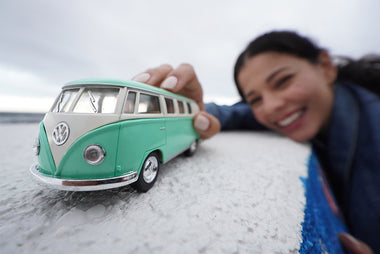 close up of woman playing with VW Bus toy