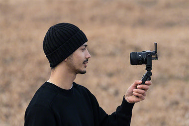 Vlogger using selfie kit with Sony APS-C 15mm lens