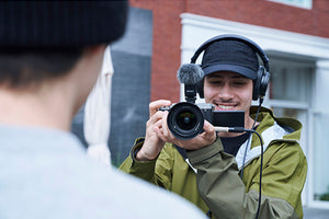 videographer filming an interview